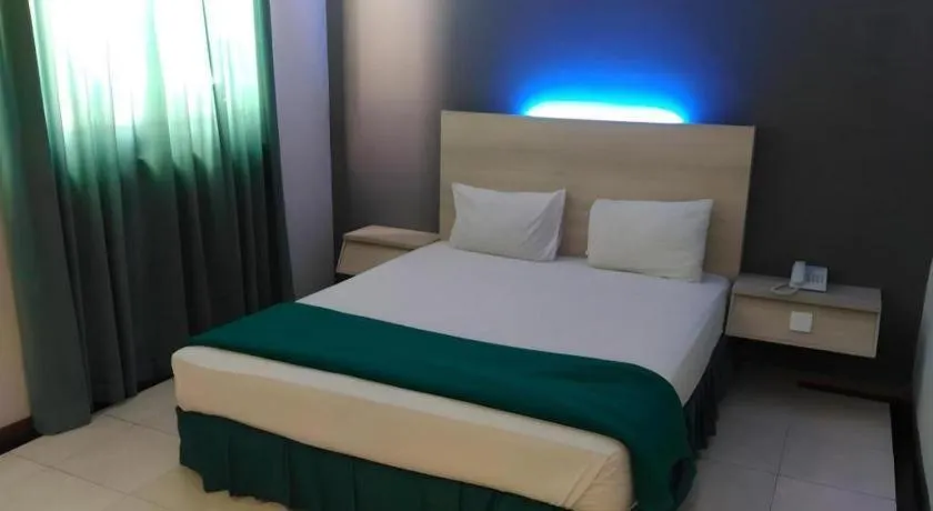 Bed in Kharisma Hotel