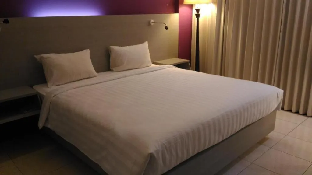 Bed in Kharisma Hotel