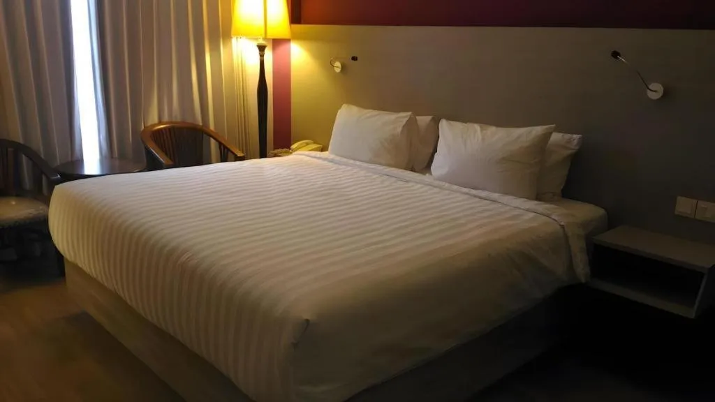 Bed in Kharisma Hotel