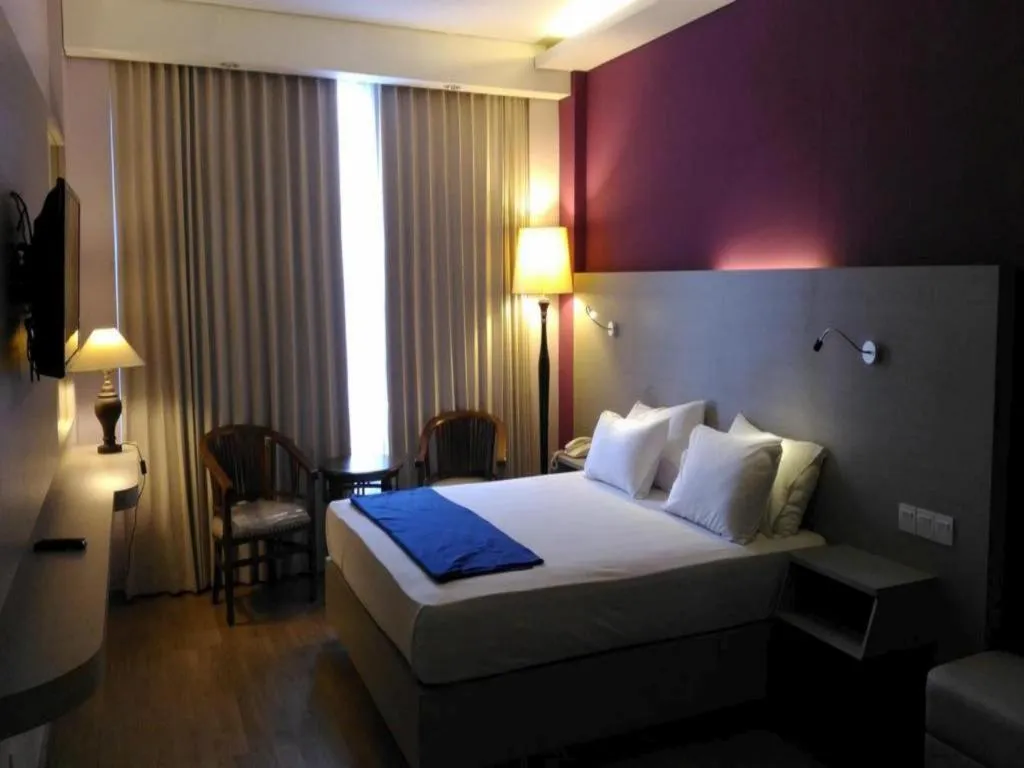 Bed in Kharisma Hotel