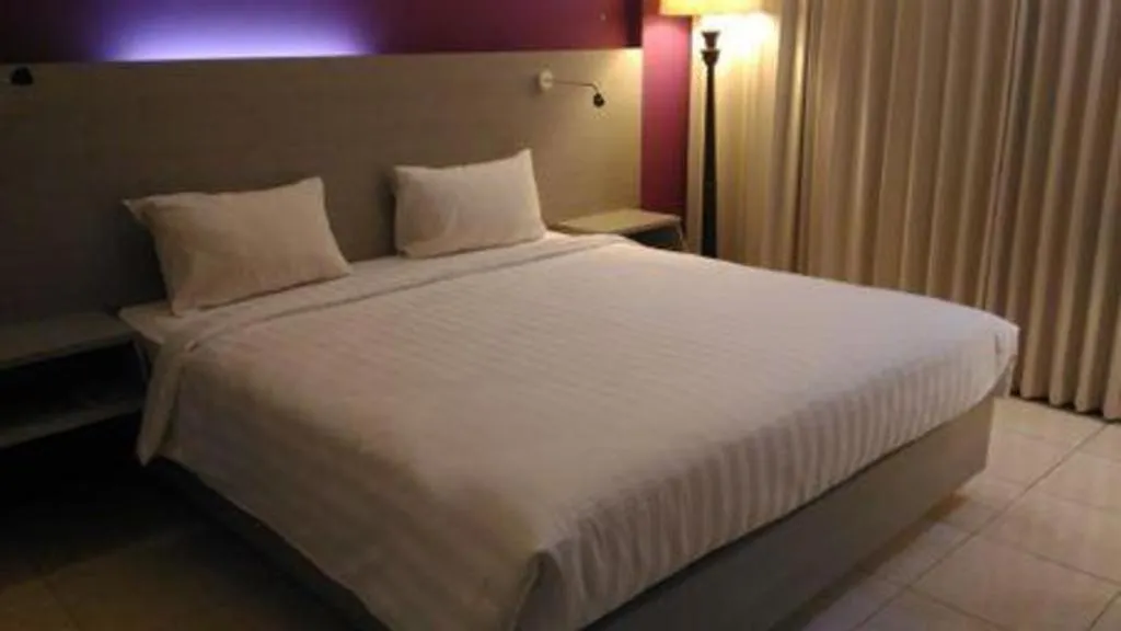 Bed in Kharisma Hotel
