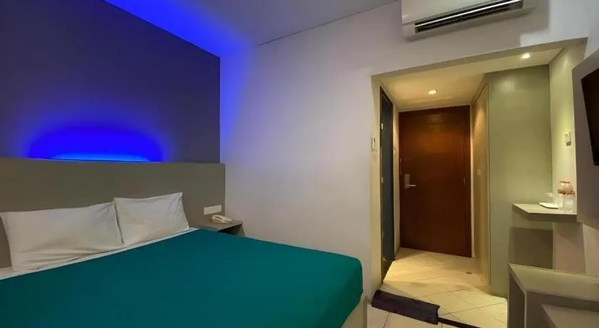 Bed in Kharisma Hotel