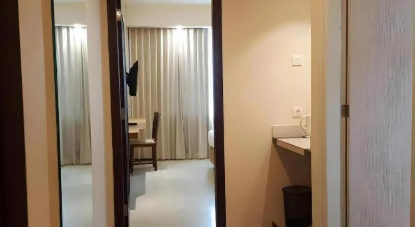 Bed in Kharisma Hotel