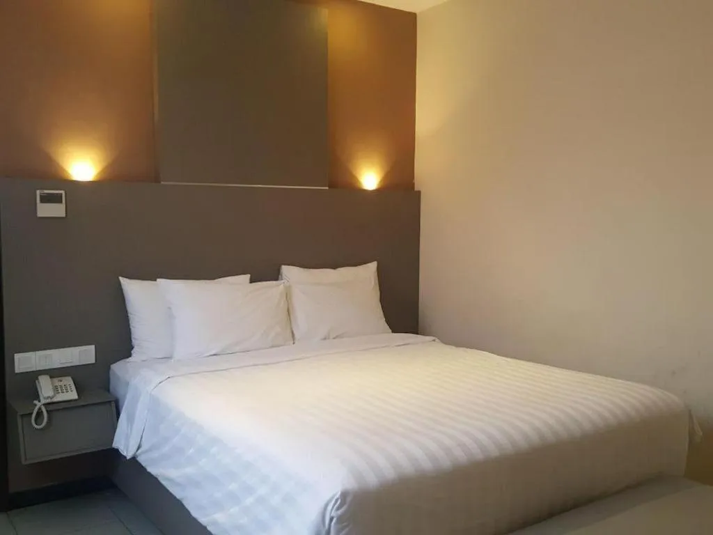 Bed in Kharisma Hotel