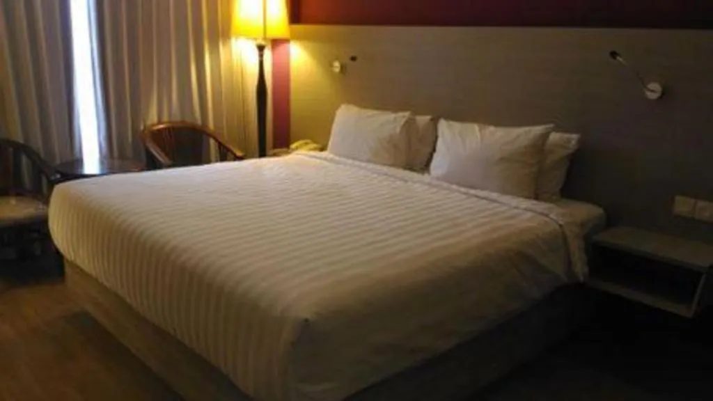 Bed in Kharisma Hotel