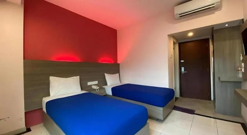 Bed in Kharisma Hotel
