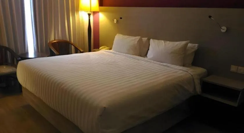 Bed in Kharisma Hotel