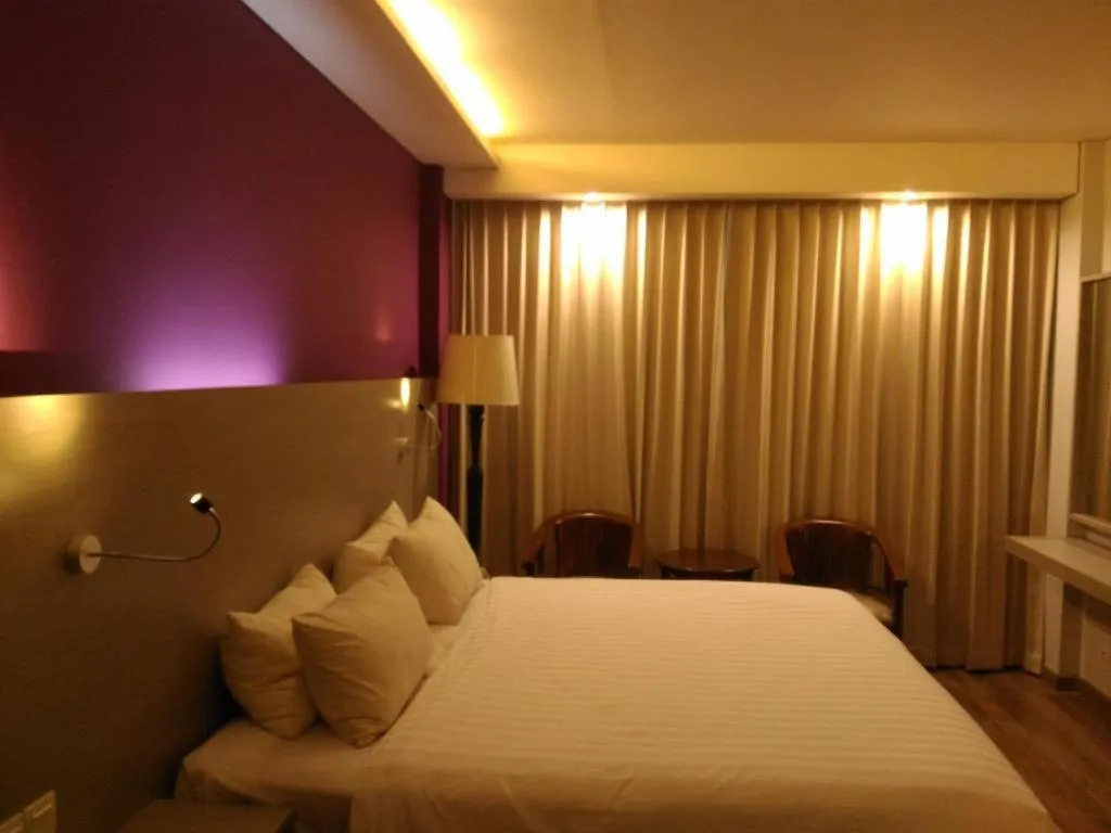 Bed in Kharisma Hotel