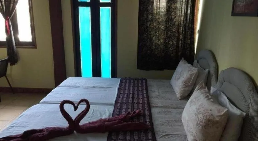 Bed in Sritrang Hotel