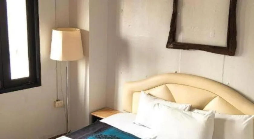 Bed in Sritrang Hotel