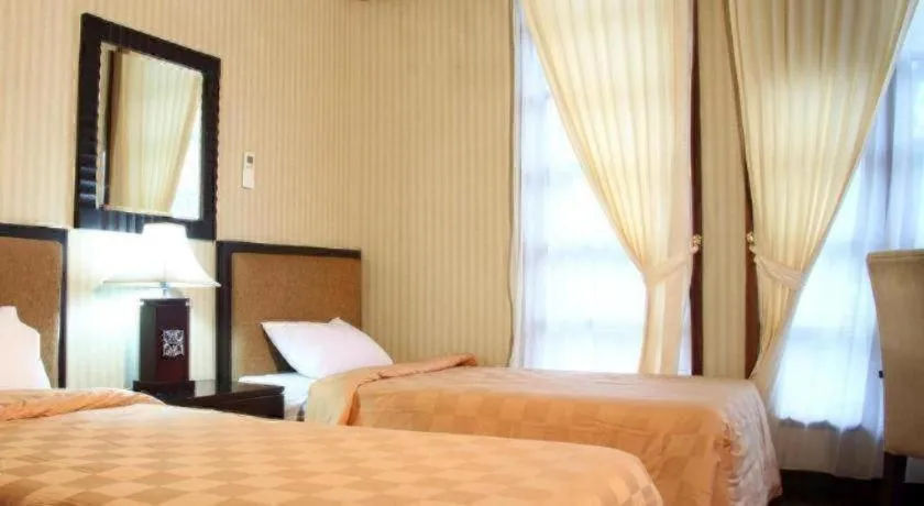 Bed in Campago Resort Hotel