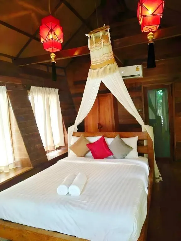 Bed in Chivaree Hotel and Resort