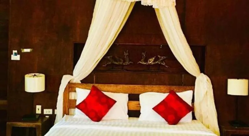 Bed in Chivaree Hotel and Resort