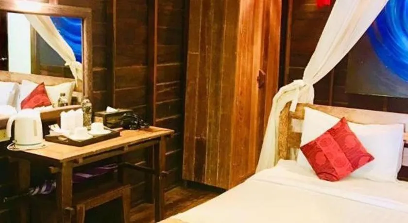 Bed in Chivaree Hotel and Resort