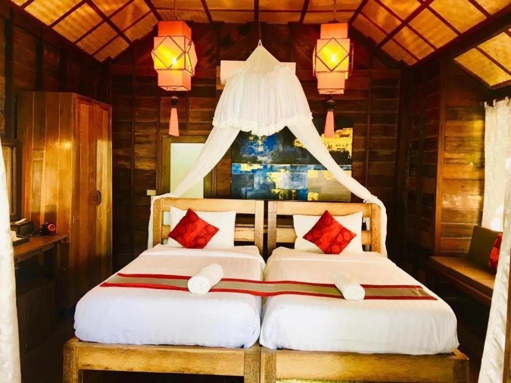 Bed in Chivaree Hotel and Resort
