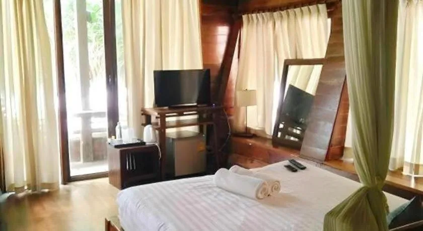 Bed in Chivaree Hotel and Resort