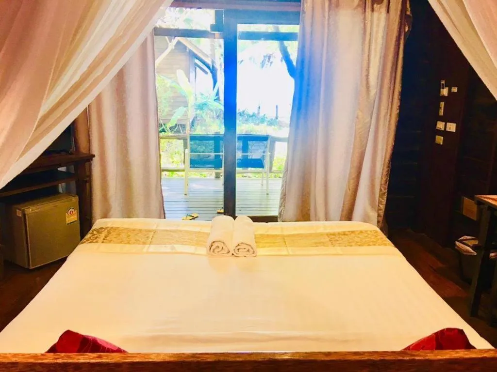 Bed in Chivaree Hotel and Resort