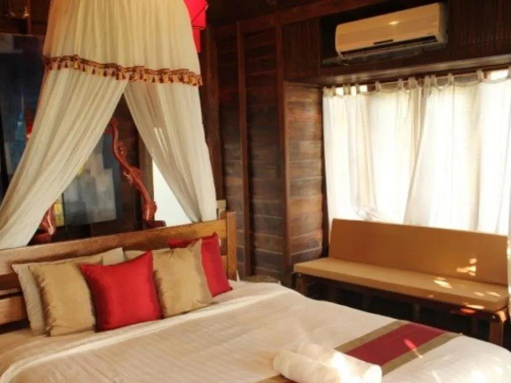 Bed in Chivaree Hotel and Resort