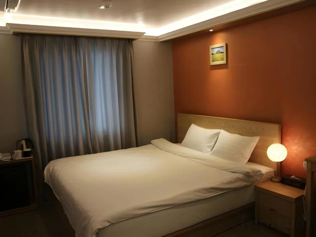 Bed in Jeju Sejong Hotel