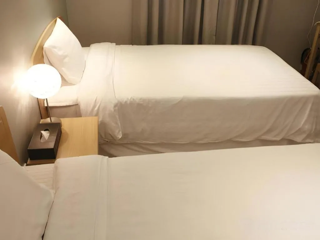 Bed in Jeju Sejong Hotel