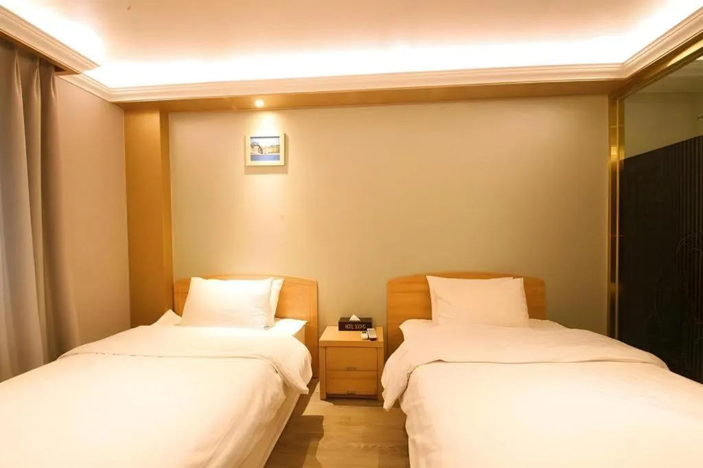 Bed in Jeju Sejong Hotel