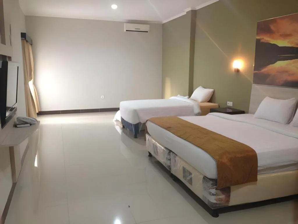 Bed in Asoka City Bali Hotel