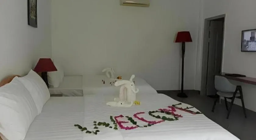 Bed in Damina boutique hotel