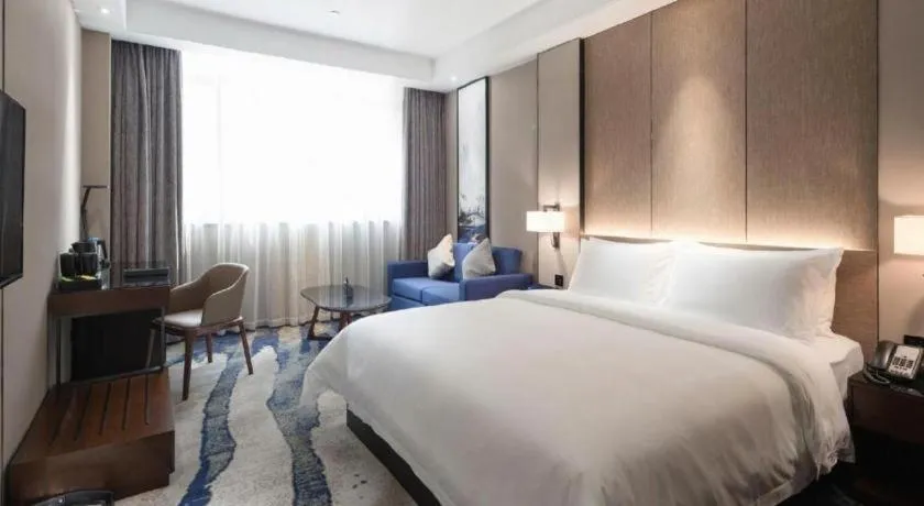 Bed in Zhonghao Boutique Hotel Dalang Business Center