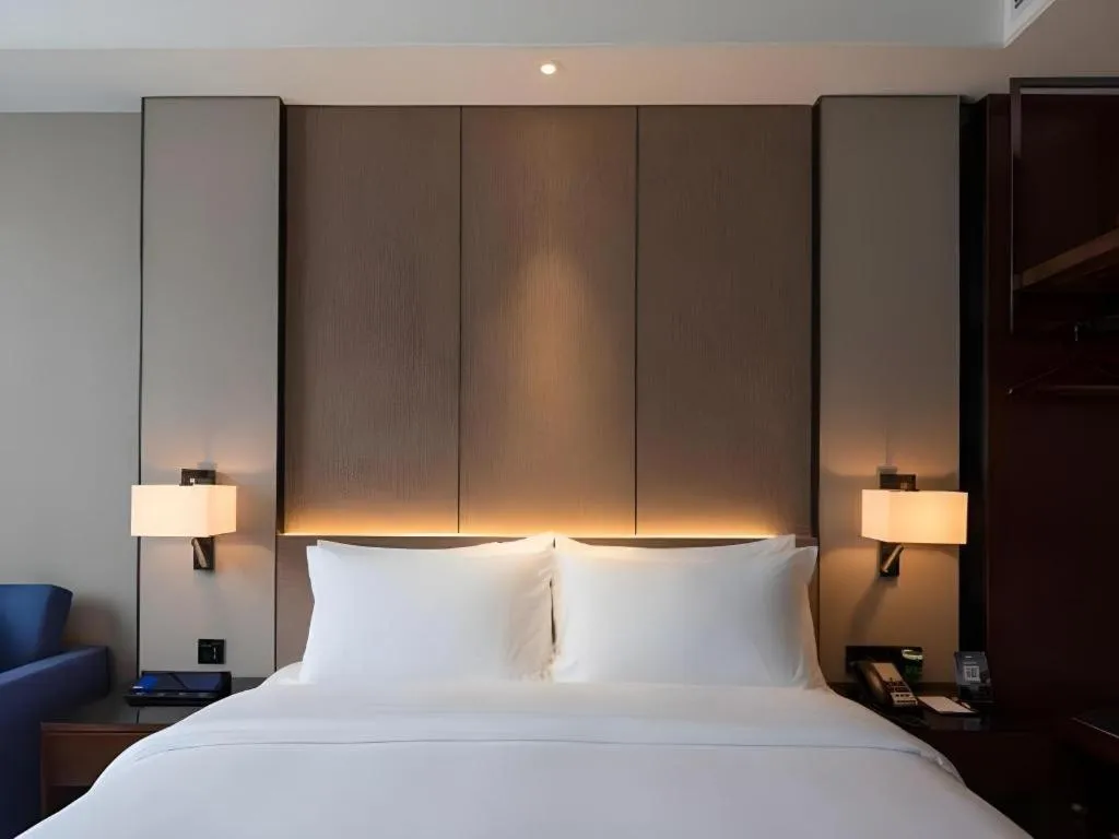 Bed in Zhonghao Boutique Hotel Dalang Business Center