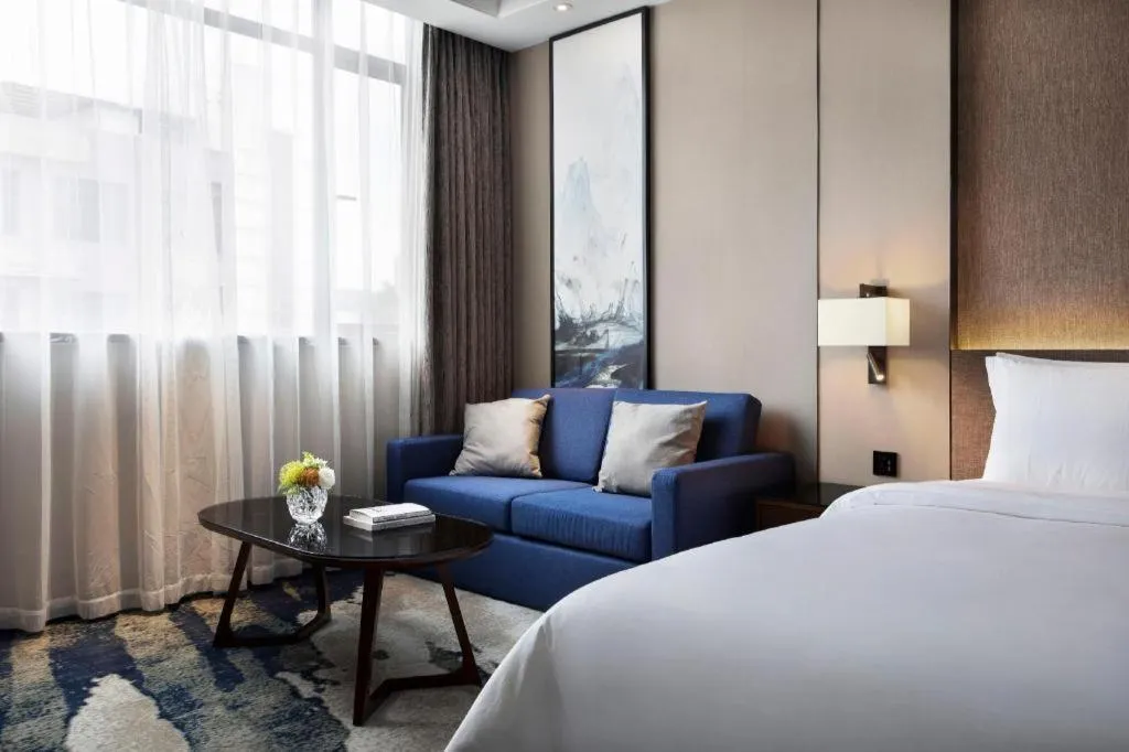 Bed in Zhonghao Boutique Hotel Dalang Business Center