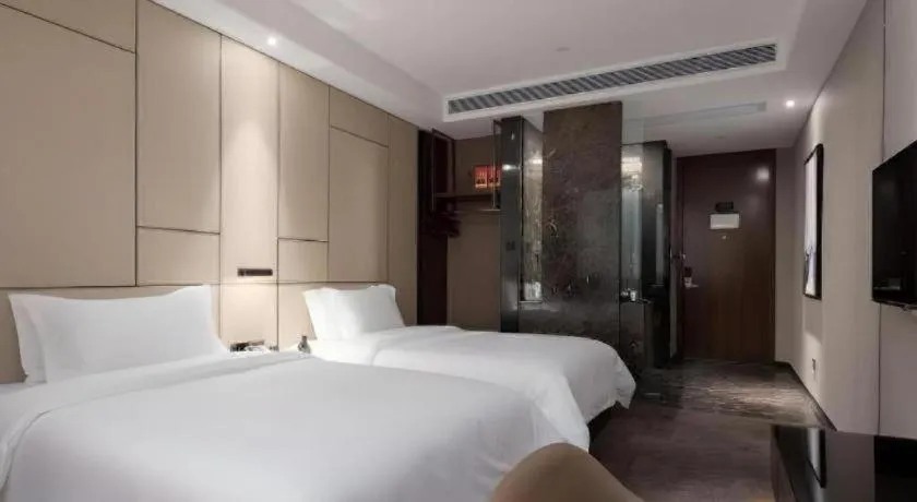 Bed in Zhonghao Boutique Hotel Dalang Business Center