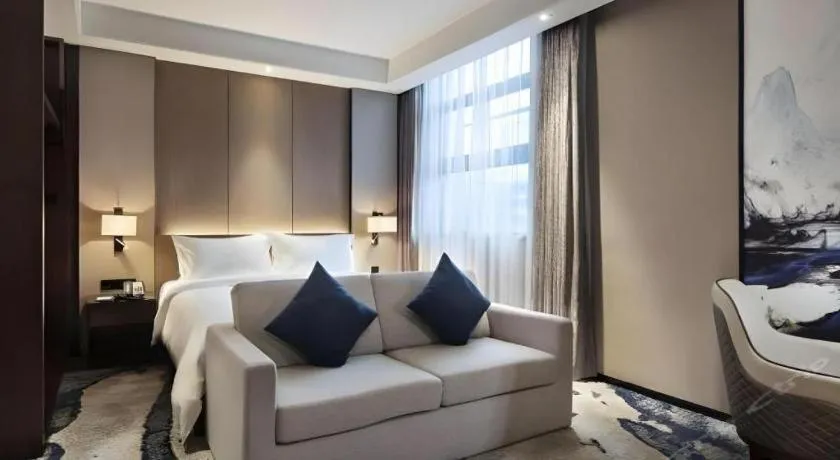 Bed in Zhonghao Boutique Hotel Dalang Business Center