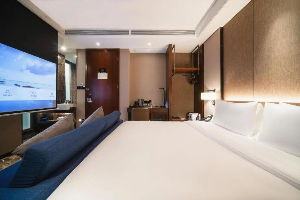 Bed in Zhonghao Boutique Hotel Dalang Business Center