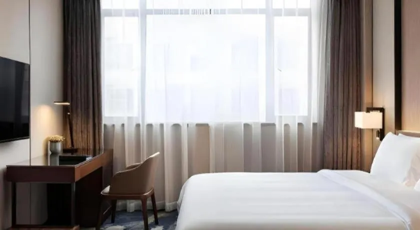 Bed in Zhonghao Boutique Hotel Dalang Business Center