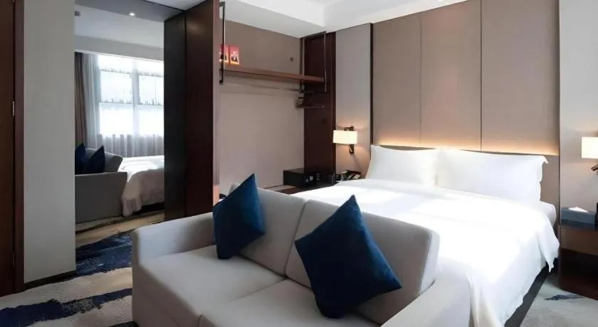 Bed in Zhonghao Boutique Hotel Dalang Business Center