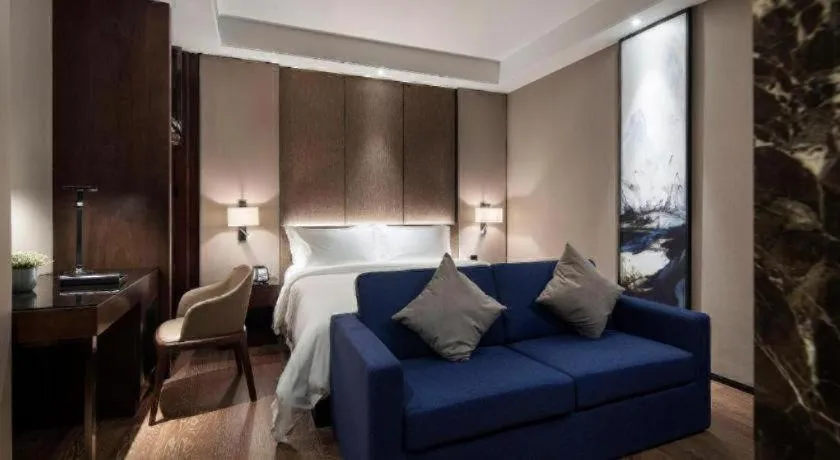 Bed in Zhonghao Boutique Hotel Dalang Business Center