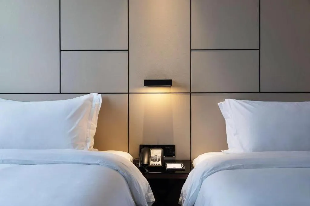 Bed in Zhonghao Boutique Hotel Dalang Business Center