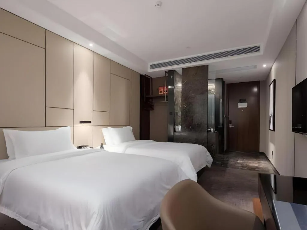Bed in Zhonghao Boutique Hotel Dalang Business Center