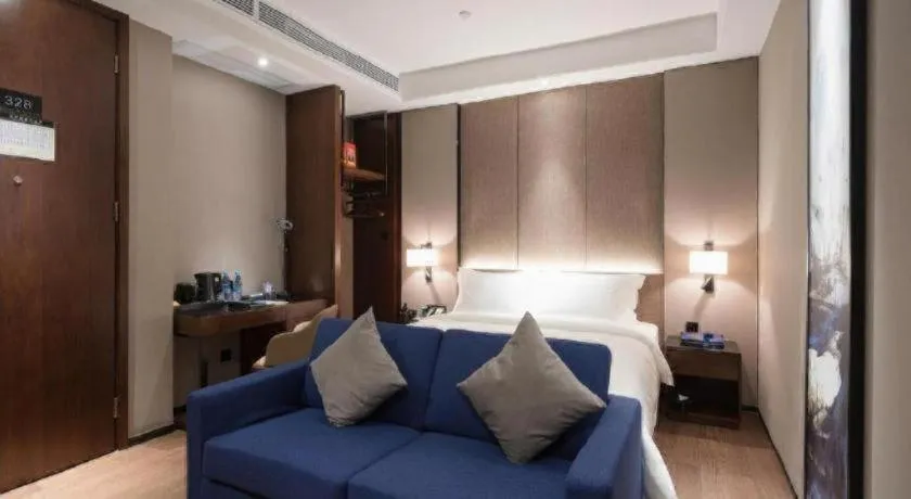Bed in Zhonghao Boutique Hotel Dalang Business Center