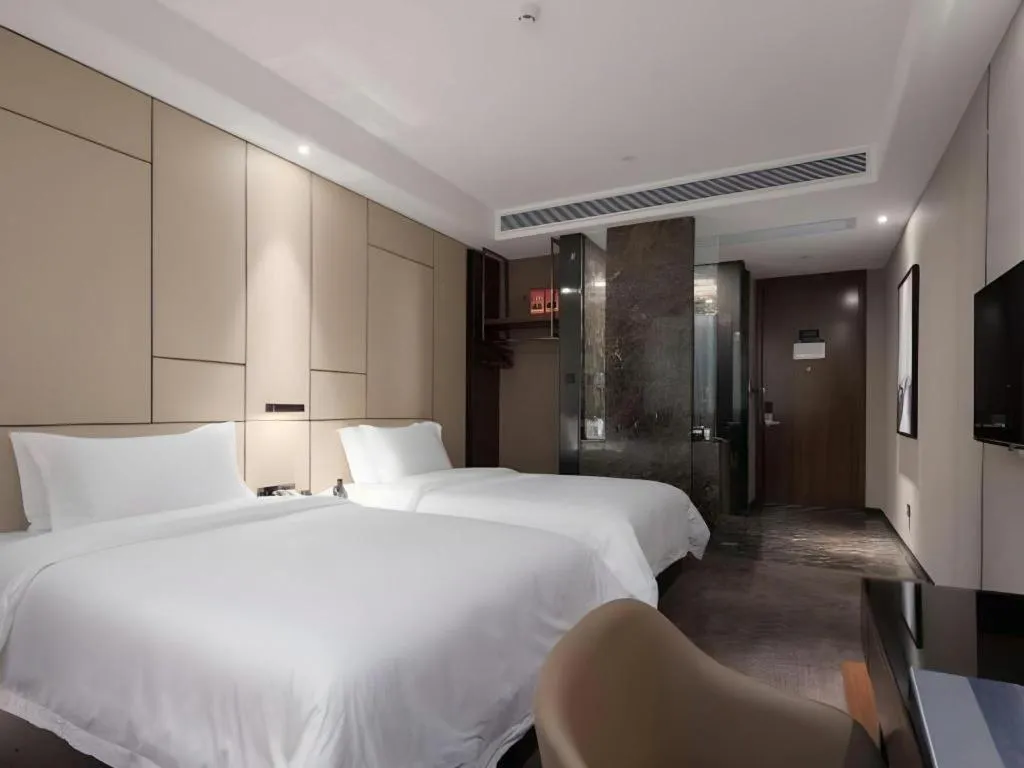 Bed in Zhonghao Boutique Hotel Dalang Business Center