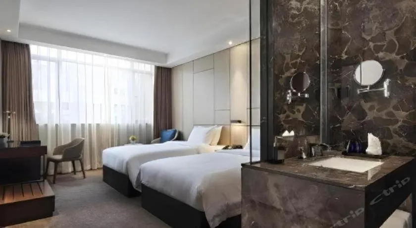 Bed in Zhonghao Boutique Hotel Dalang Business Center