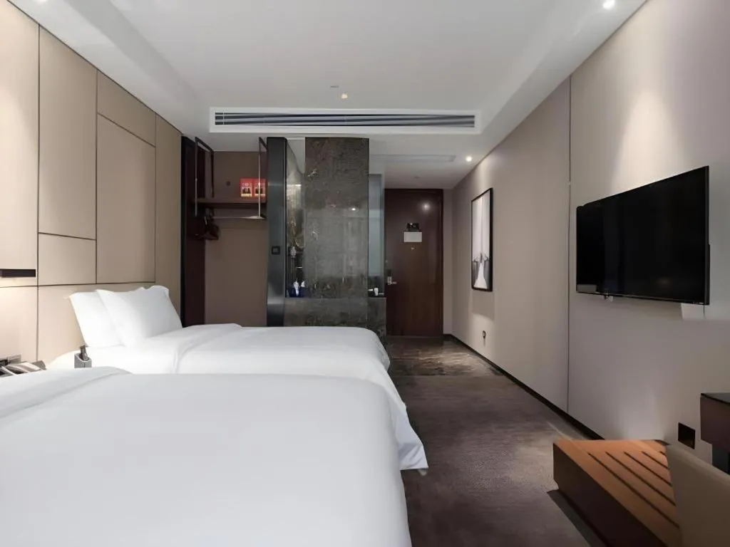 Bed in Zhonghao Boutique Hotel Dalang Business Center