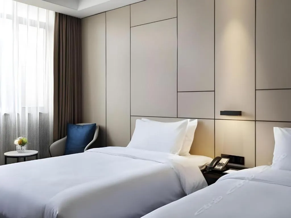 Bed in Zhonghao Boutique Hotel Dalang Business Center