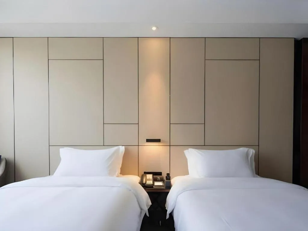 Bed in Zhonghao Boutique Hotel Dalang Business Center