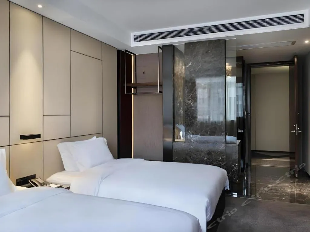 Bed in Zhonghao Boutique Hotel Dalang Business Center