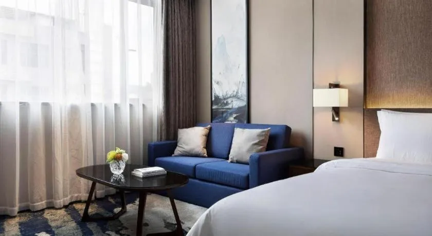 Bed in Zhonghao Boutique Hotel Dalang Business Center