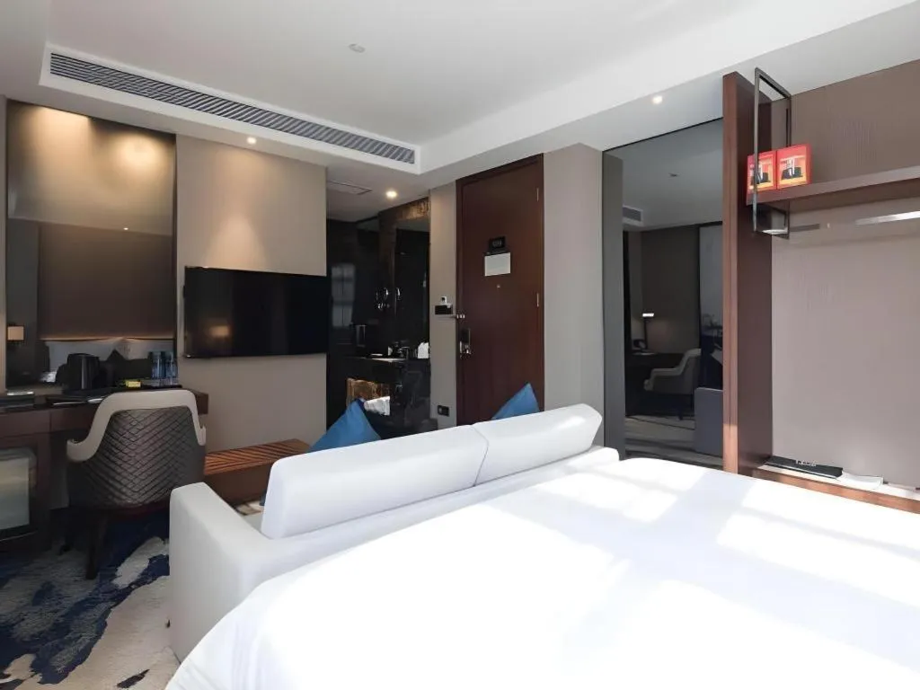 Bed in Zhonghao Boutique Hotel Dalang Business Center