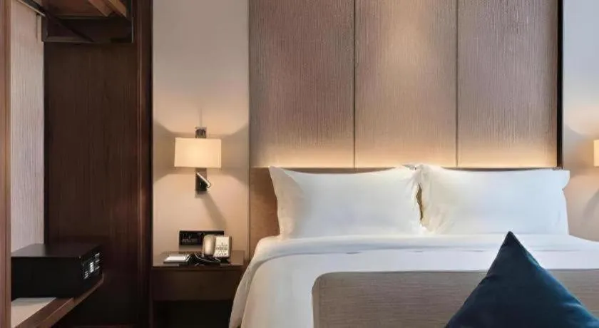 Bed in Zhonghao Boutique Hotel Dalang Business Center