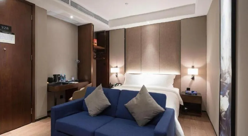 Bed in Zhonghao Boutique Hotel Dalang Business Center