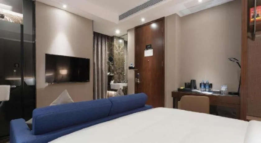 Bed in Zhonghao Boutique Hotel Dalang Business Center